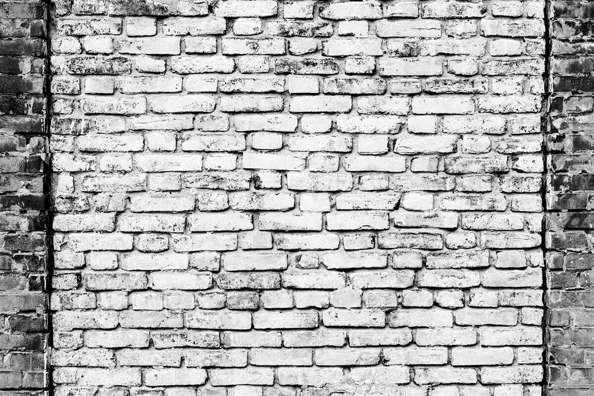 Fototapet Perete din cărămidă cu urme de zgârieturi