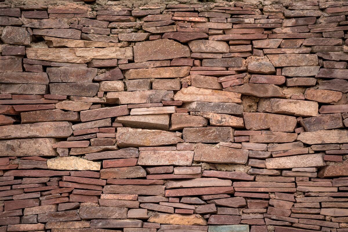 Fototapet barieră de piatră maro cu textură neuniformă