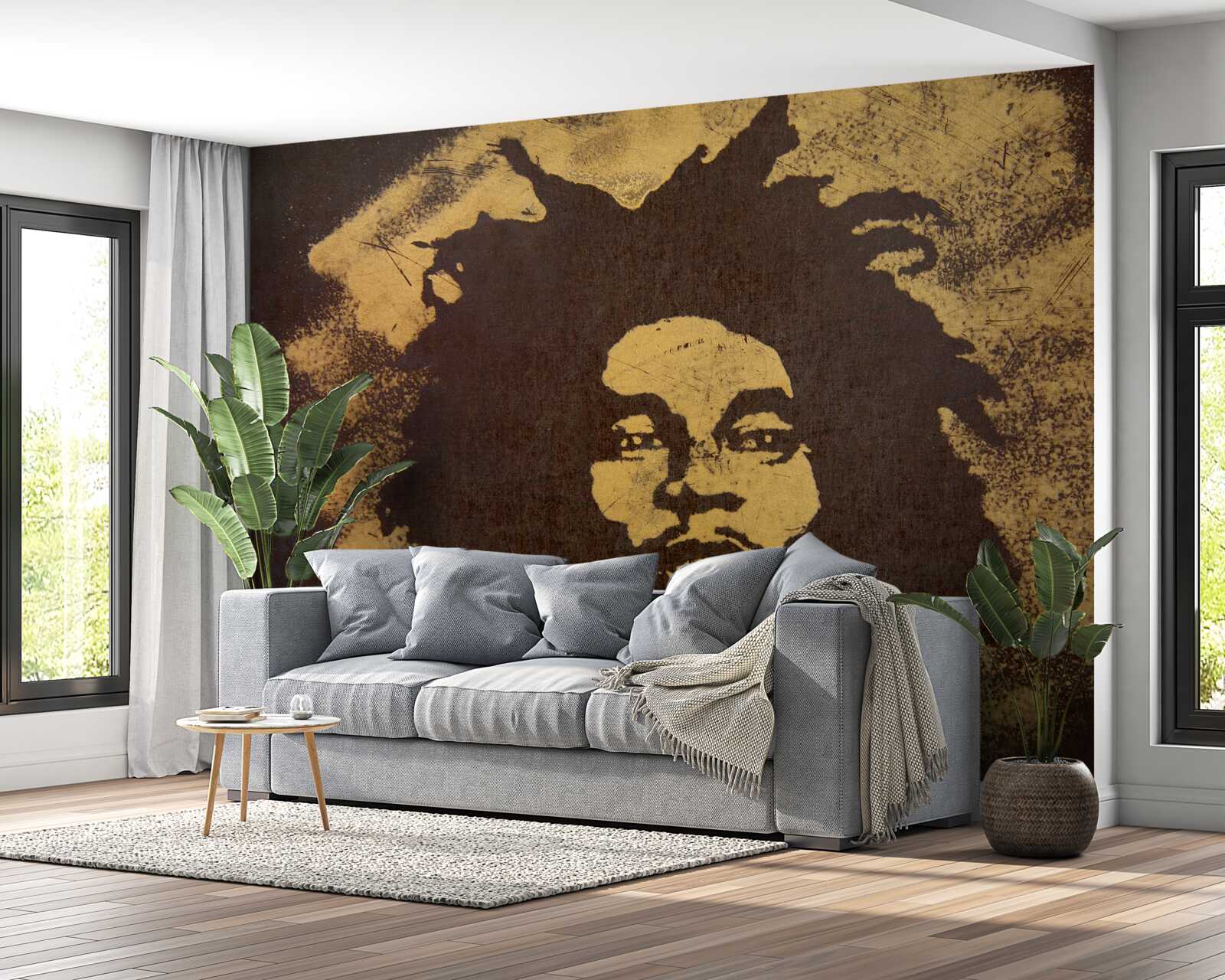 Fototapet un bărbat cu o coafură africană stă pe nisip