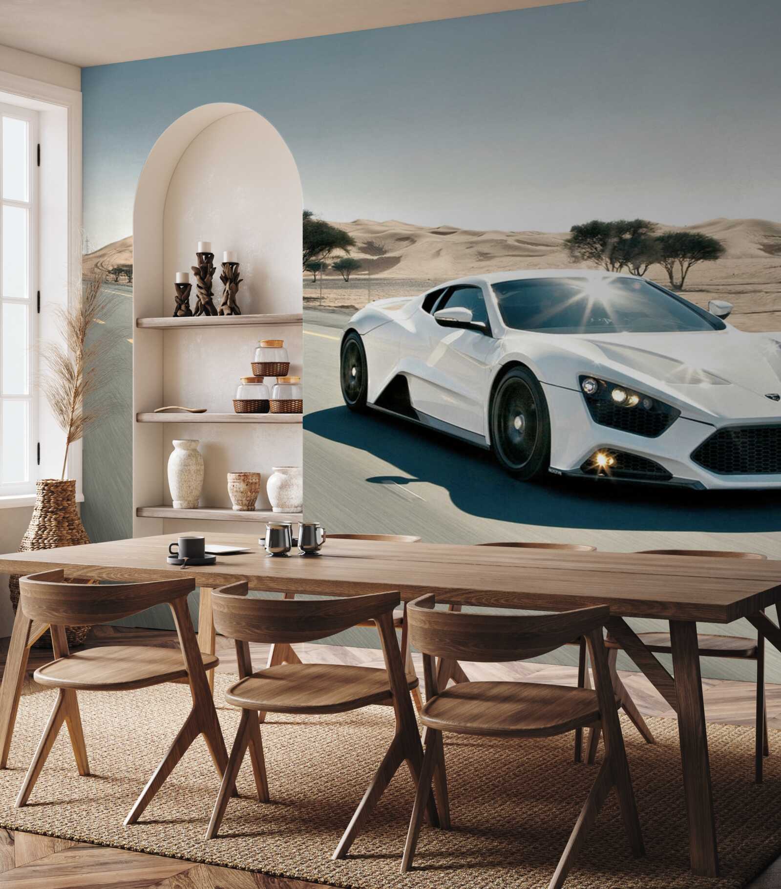 Fototapet o mașină sport albă conduce pe un drum pustiu